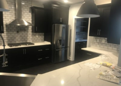 black cabinets and marble countertops