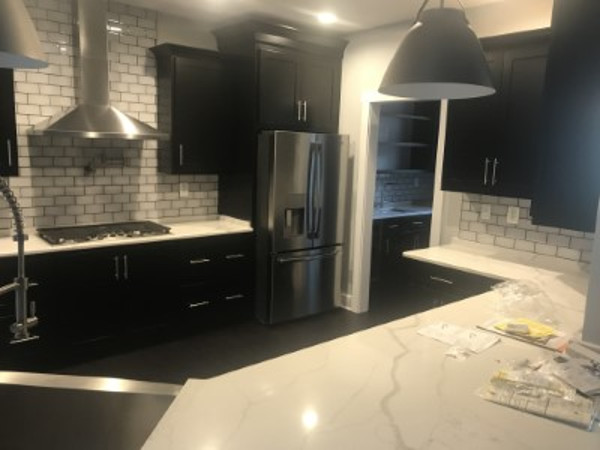 black cabinets and marble countertops